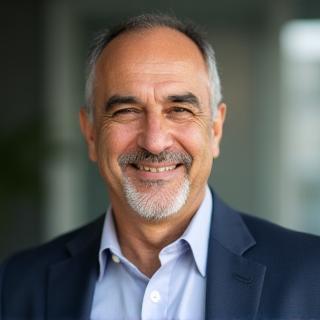 Professional headshot of Ali Kaya